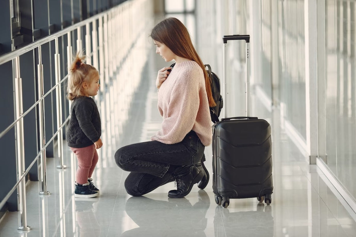 6 Diaper Bag Tips for Families to Survive Long Flights With a Baby